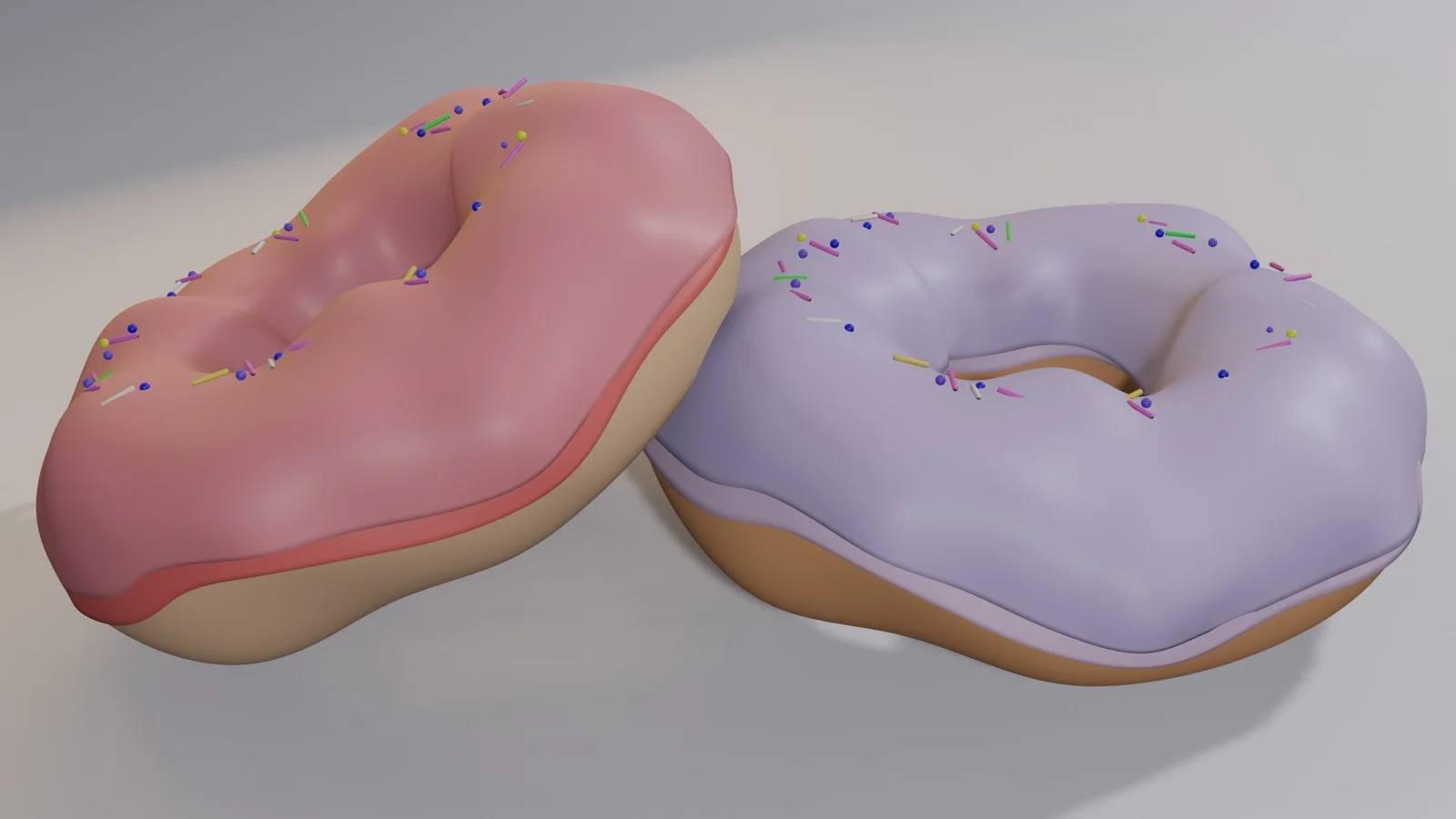Two doughnuts with pink and lavender icing and scattered sprinkles.