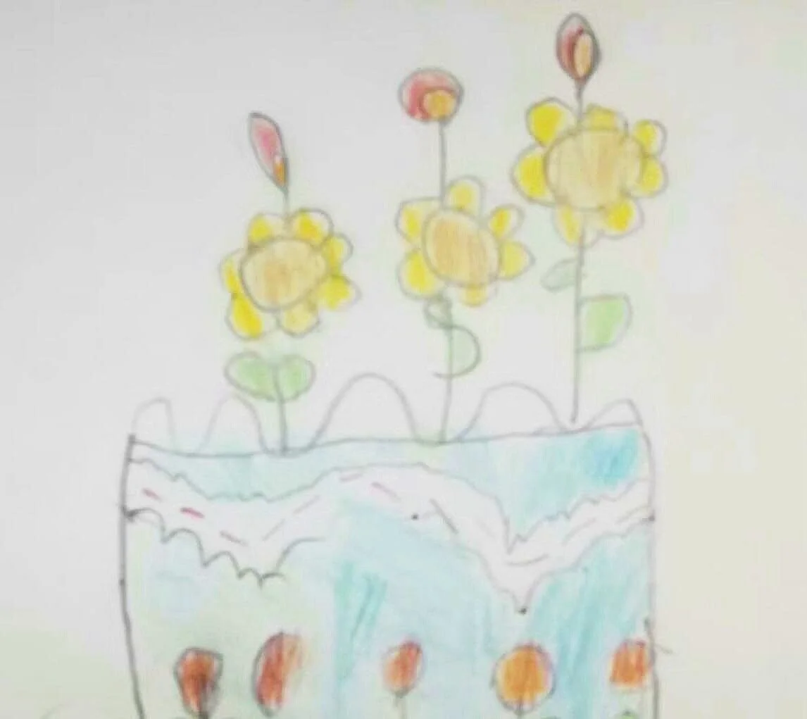 Drawing of a decorated cake with flower-shaped candles.